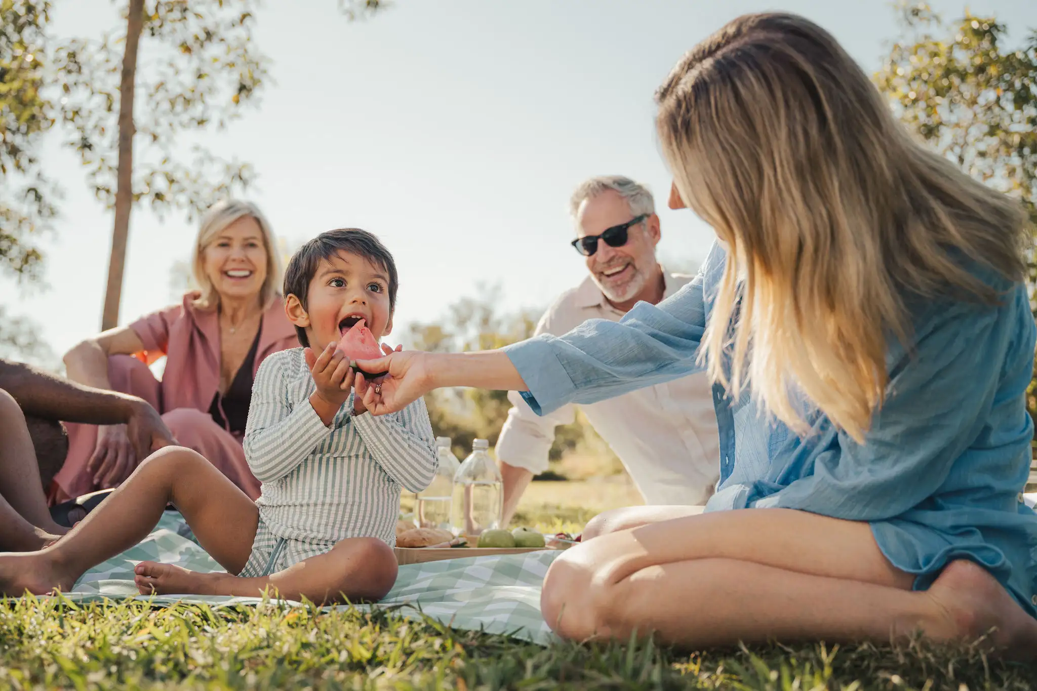 People having a picnic on a blanket